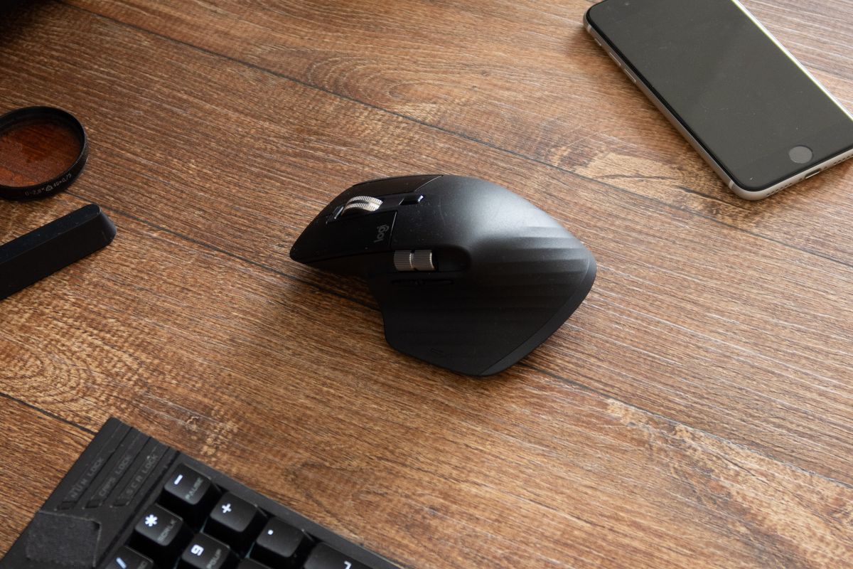 A hard plastic mousepad beside a cloth one
