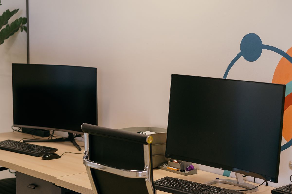 A gaming chair and an office chair side by side