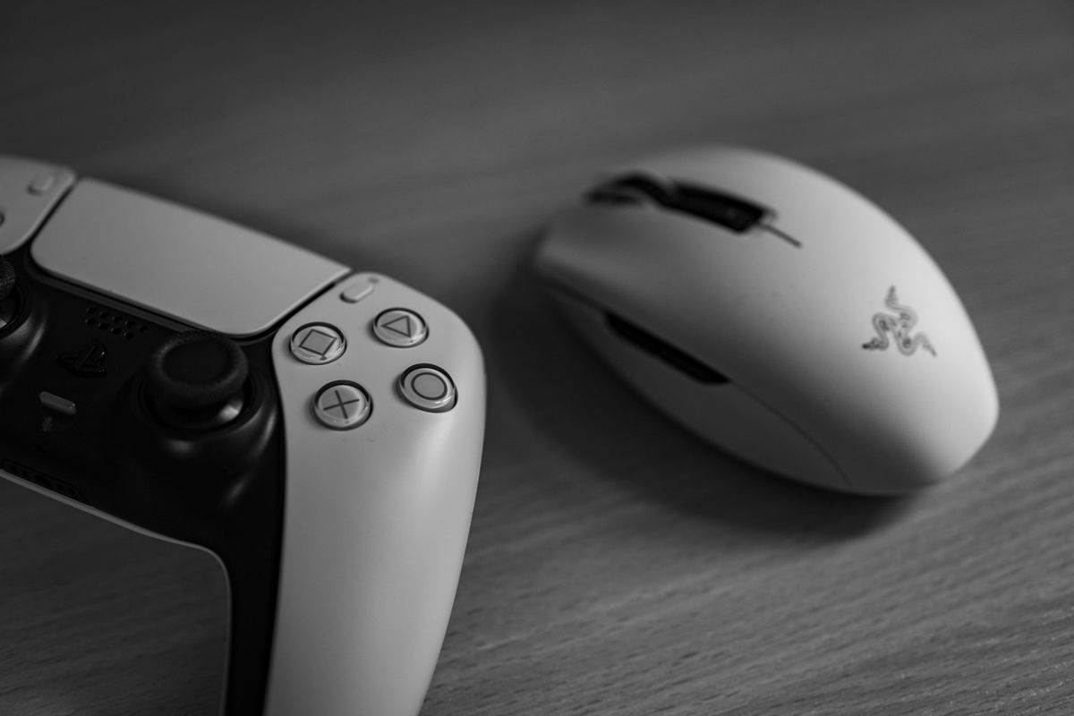 A feather-light gaming mouse balanced on a fingertip