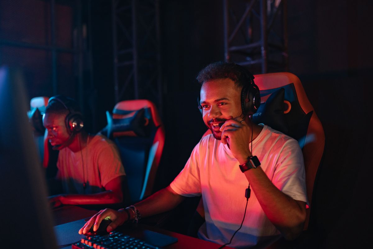 A gamer speaking into a boom microphone