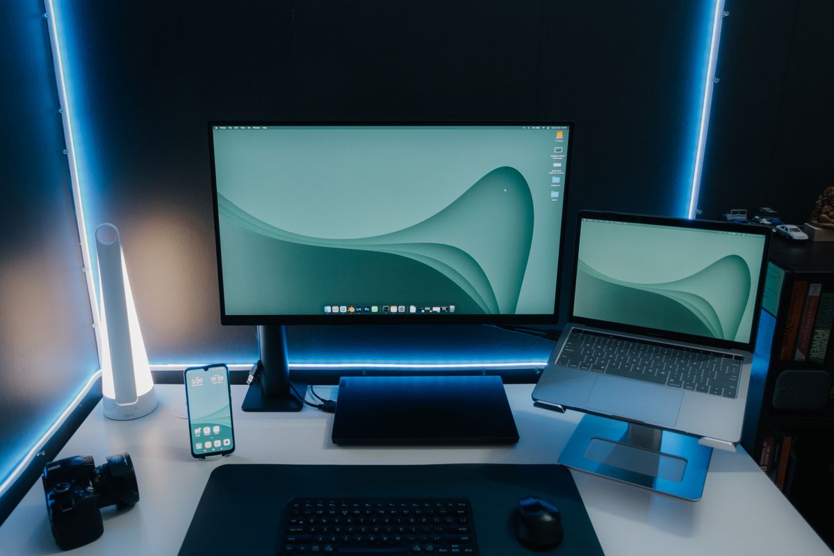 A curved gaming monitor on a desk setup