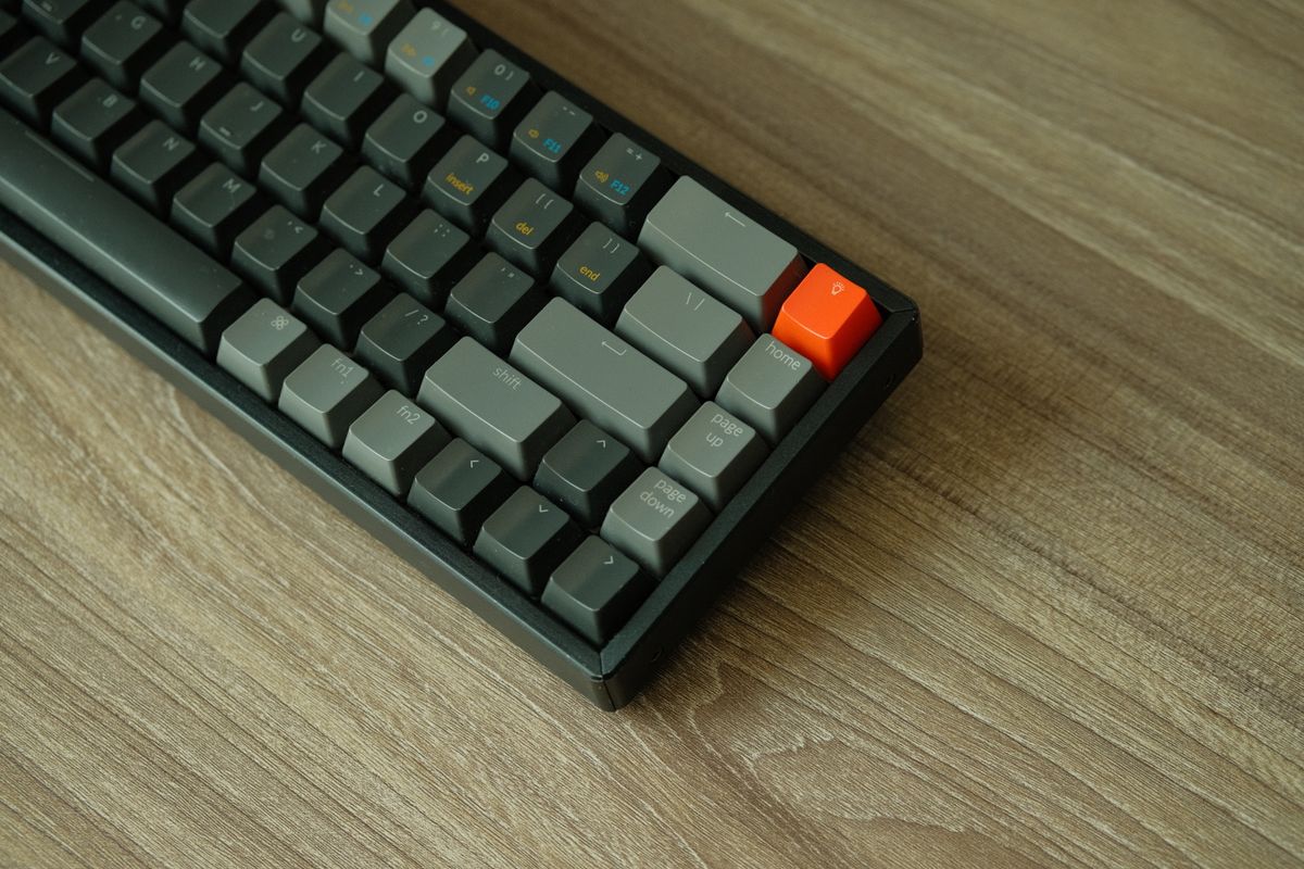 A wireless mechanical keyboard with its USB dongle